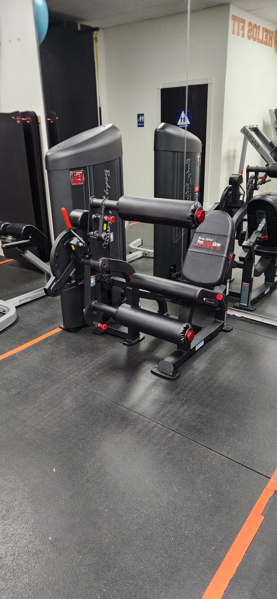 Body-Solid seated leg curl machine on the Helios Fit floor